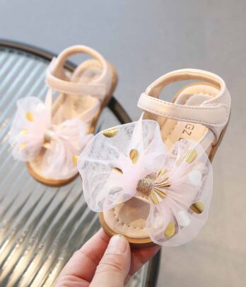 Paire de sandales roses à nœuds sur le devant