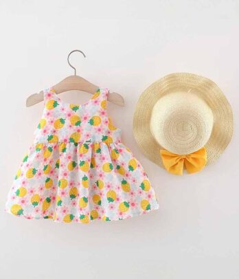 Robe à motifs colorés avec chapeau en paille