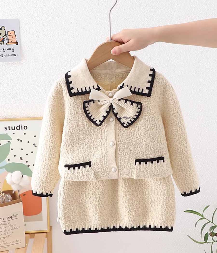 O1CN01xHx2Z61NvVGIs4kgq_!!2039121632-0-cib Ensemble de jupe et cardigan blanc aux traits noirs pour fillettes – Image 1