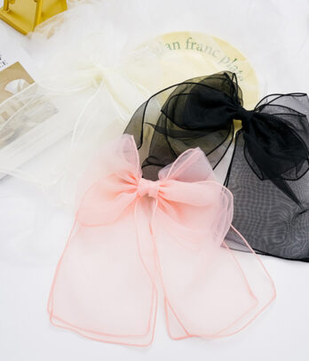 Accessoire pour cheveux en tulle sous forme de papillon
