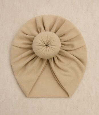 Turban de bébé en forme de beignet de couleur beige