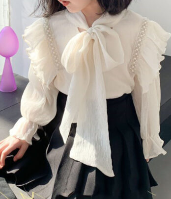 Blouse fille élégante – nœud et volants délicats